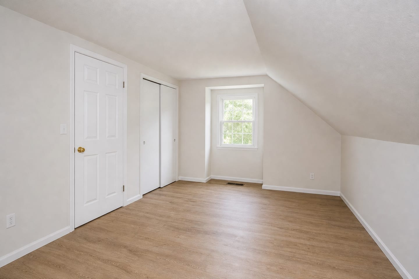 Empty small upstairs bedroom with a ceiling sloping to a knee wall, a dormer window, a reach-in closet with sliding doors and wood-look laminate flooring, shown before and after virtual staging with a single twin bed, toy storage, a floor cushion and a striped rug — before